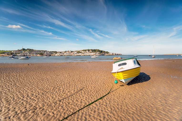 Yellow boat on sand at Instow beach