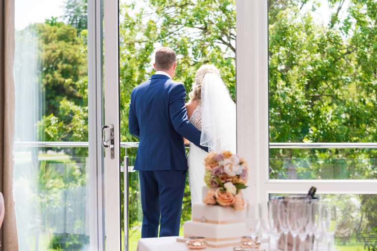 bride and groom stood on the balcony at the park hotel