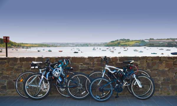 Bikes Leaning on Wall with a View Over the Estuary at Instow North Devon