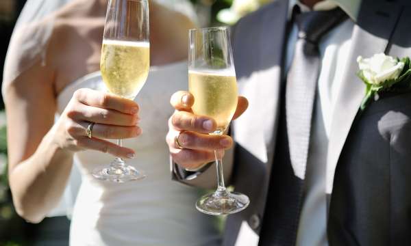 Bride and Groom toasting with champagne at their wedding