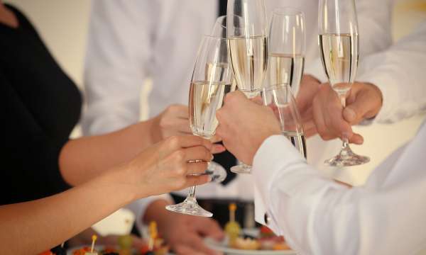 Wedding guests making a toast with champagne