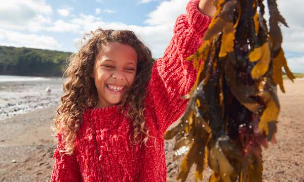 girl holding seaweed