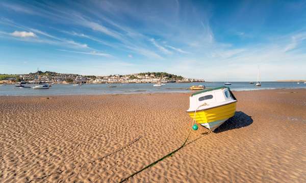 Yellow boat on sand at Instow beach