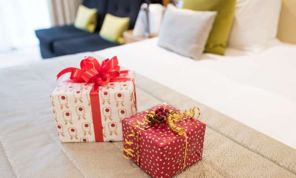 Christmas Presents on Bed At Park Hotel's Room