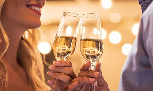 Couple Toasting with Champagne when Celebrating Anniversary 