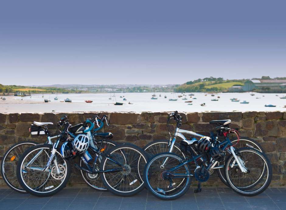 Bikes Leaning on Wall with a View Over the Estuary at Instow North Devon