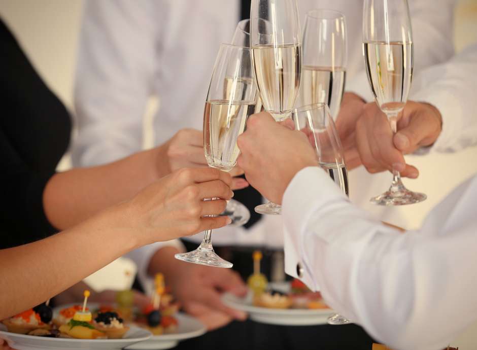 Wedding guests making a toast with champagne