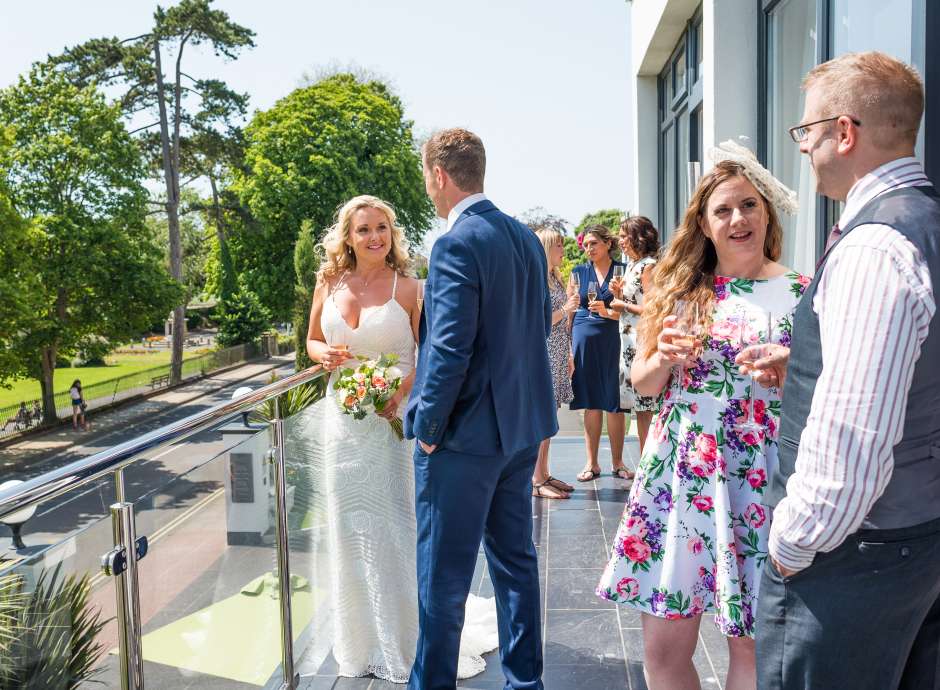 Wedding Couple and Guests at Park Suite Balcony