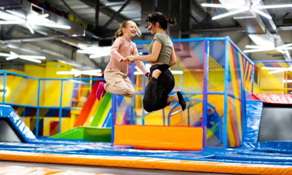 2 girls on trampolines