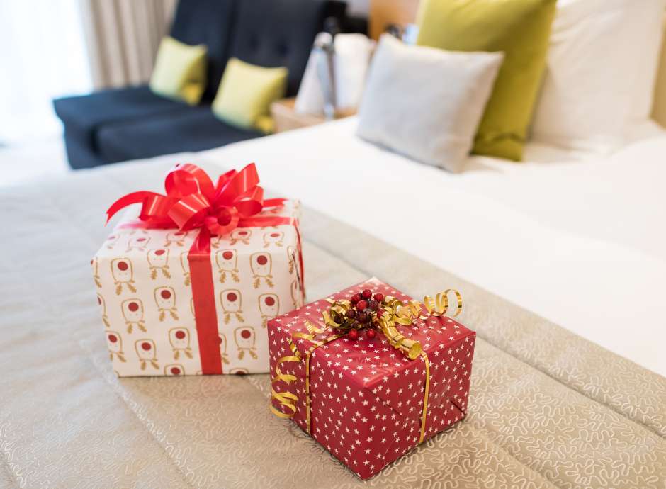 Christmas Presents on Bed At Park Hotel's Room